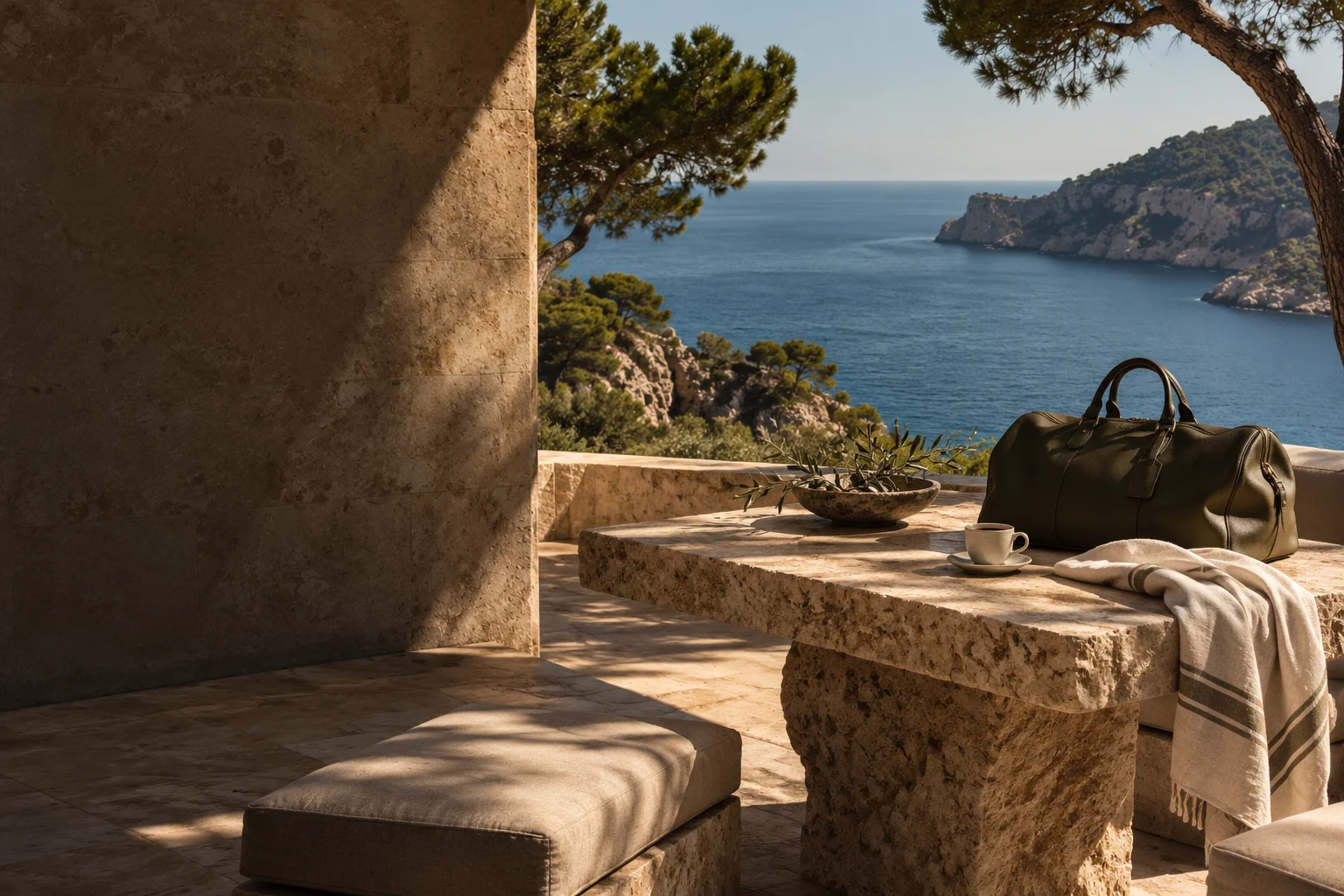 Conceptual Mediterranean terrace with an unbranded weekender bag beside the sea